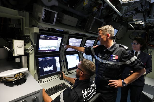 French navy commander Axel Roche poses in the navigation and operations center of nuclear submarine "Suffren" in Cherbourg, north-western France on July 12, 2019, during its launch ceremony.