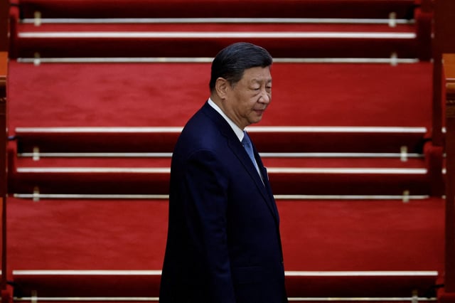 Chinese President Xi Jinping arrives for the second plenary session of the National People's Congress (NPC), at the Great Hall of the People in Beijing, China March 8, 2025. REUTERS/Tingshu Wang/File Photo