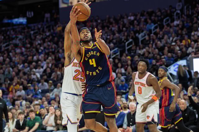 Mar 15, 2025; San Francisco, California, USA; Golden State Warriors guard Moses Moody (4) shoots a layup against New York Knicks forward Mikal Bridges (25) during the fourth quarter at Chase Center. Mandatory Credit: Neville E. Guard-Imagn Images