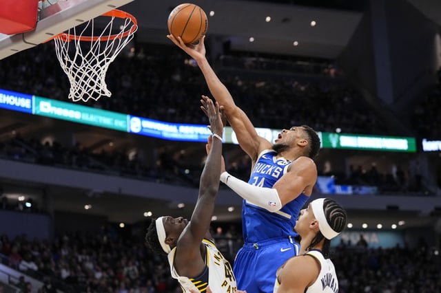 Mar 15, 2025; Milwaukee, Wisconsin, USA;  Milwaukee Bucks forward Giannis Antetokounmpo (34) shoots during the fourth quarter against the Indiana Pacers at Fiserv Forum. Mandatory Credit: Jeff Hanisch-Imagn Images