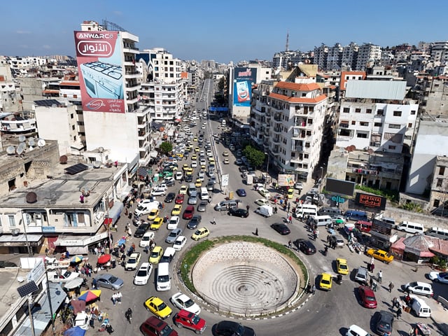 A drone view shows traffic passing by residential buildings, as Syria's interim President Ahmed al-Sharaa grapples with the fallout from reported mass killings of Alawite minority members, in Latakia, Syria March 11, 2025. REUTERS/Karam al-Masri/File Photo