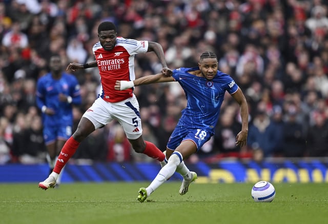 Soccer Football - Premier League - Arsenal v Chelsea - Emirates Stadium, London, Britain - March 16, 2025 Chelsea's Christopher Nkunku in action with Arsenal's Thomas Partey REUTERS/Tony O Brien