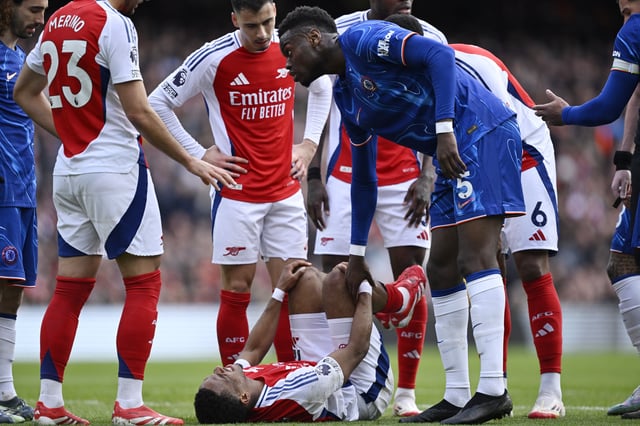 Soccer Football - Premier League - Arsenal v Chelsea - Emirates Stadium, London, Britain - March 16, 2025 Arsenal's Jurrien Timber reacts after sustaining an injury REUTERS/Tony O Brien