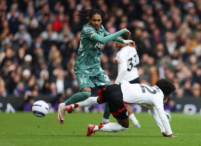 Soccer Football - Premier League - Fulham v Tottenham Hotspur - Craven Cottage, London, Britain - March 16, 2025 Tottenham Hotspur's Djed Spence in action with Fulham's Willian REUTERS/Isabel Infantes