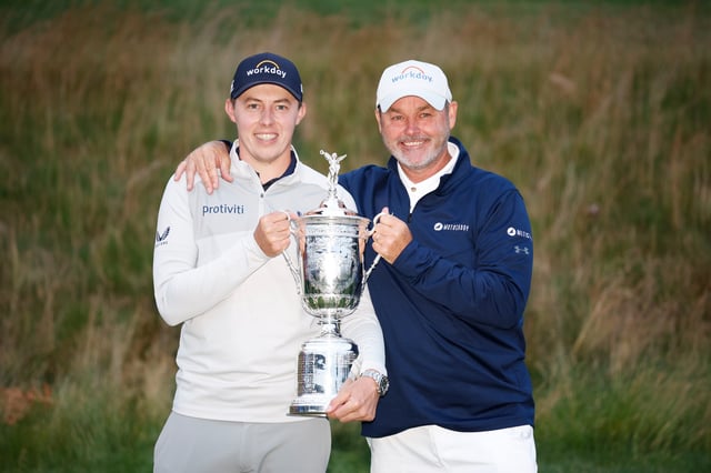Matt Fitzpatrick of England and caddie Billy Foster celebrate with the U.S. Open Championship trophy after winning during the final round of the 122nd U.S. Open Championship at The Country Club on June 19, 2022 in Brookline, Massachusetts.