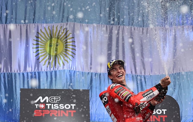 MotoGP - Argentina Grand Prix - Autodromo Termas de Rio Hondo, Santiago del Estero, Argentina - March 15, 2025 Ducati Lenovo Team's Marc Marquez sprays champagne on the podium as he celebrates after winning the sprint race REUTERS/Agustin Marcarian