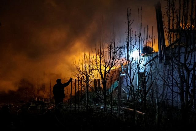 Rescuers work at the site of a building destroyed during a Russian air strike, amid Russia's attack on Ukraine, in Kherson, Ukraine March 14, 2025. REUTERS/Ivan Antypenko/File Photo