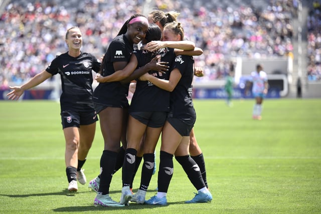 Alyssa Thompson #21 of Angel City FC celebrates with teammates after scoring a goal against the San Diego Wave FC during the first half at Snapdragon Stadium on August 24, 2024 in San Diego, California.