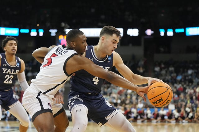 Mar 24, 2024; Spokane, WA, USA; Yale Bulldogs guard John Poulakidas (4) battles San Diego State Aztecs guard Lamont Butler (5) for the ball in the second half at Spokane Veterans Memorial Arena. Kirby Lee-USA TODAY Sports/File Photo