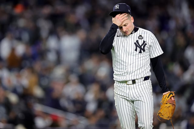 NEW YORK, NEW YORK - OCTOBER 28: Clarke Schmidt #36 of the New York Yankees reacts after a strikeout against the Los Angeles Dodgers in the second inning during Game Three of the 2024 World Series at Yankee Stadium on October 28, 2024 in the Bronx borough of New York City.