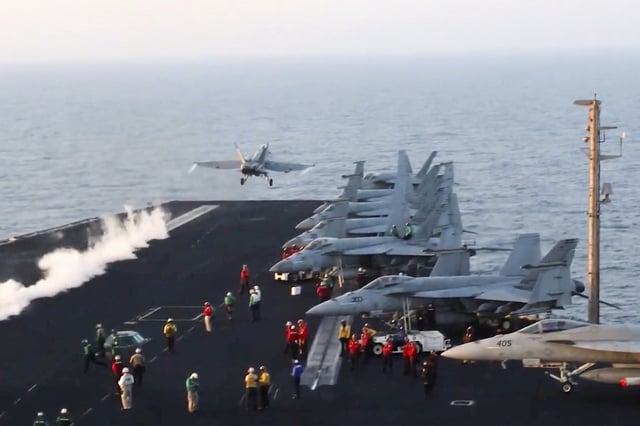 This image taken from video provided by the U.S. Navy shows an aircraft launching from the USS Harry S. Truman in the Red Sea before airstrikes in Sanaa, Yemen, Saturday, March 15, 2025