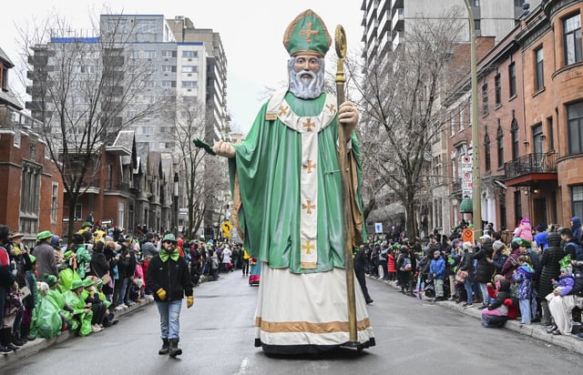 A giant St. Patrick float makes its way along a street during the St. Patrick&#39;s Day parade in Montreal, Canada, on March 17, 2024.