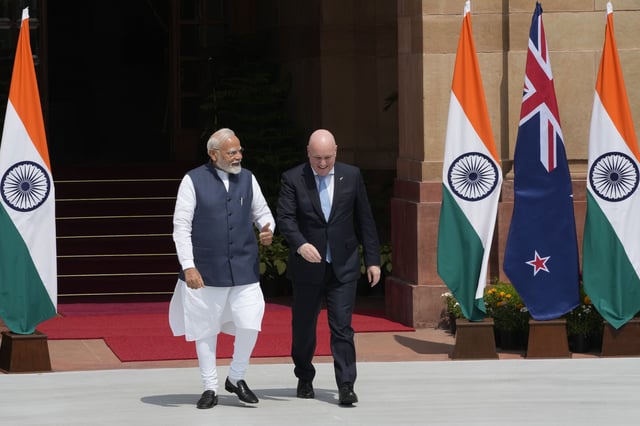 Visiting New Zealand Prime Minister Christopher Luxon, center right, speaks to Indian Prime Minister Narendra Modi before their meeting in New Delhi, India, Monday, March, 17, 2025. (AP Photo/Manish Swarup)