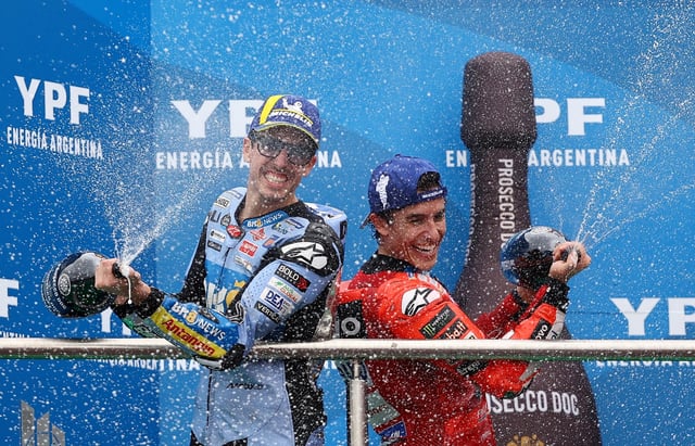 MotoGP - Argentina Grand Prix - Autodromo Termas de Rio Hondo, Santiago del Estero, Argentina - March 16, 2025 Ducati Lenovo Team's Marc Marquez celebrates as he sprays champagne on the podium after winning the race with second placed BK8 Gresini Racing MotoGP's Alex Marquez  REUTERS/Agustin Marcarian/File Photo