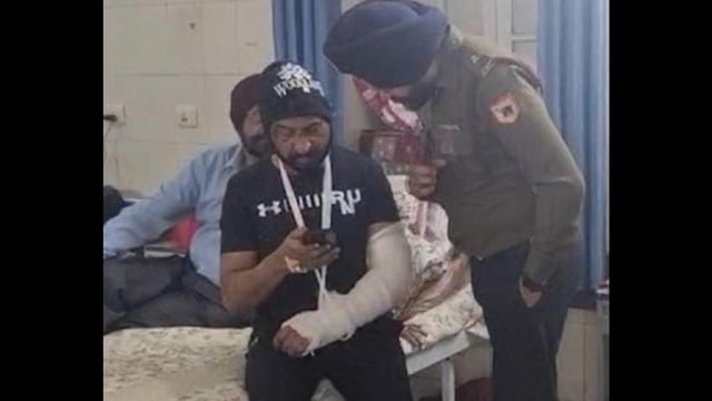 An army officer enquiring after the health of Colonel Pushpinder Bath at the Military Hospital in Patiala on Monday. The colonel suffered a fracture in the left arm in the March 13 assault. (HT Photo)