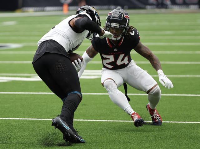 Sep 29, 2024; Houston, Texas, USA; Jacksonville Jaguars wide receiver Gabe Davis (0) runs against Houston Texans cornerback Derek Stingley Jr. (24) in the first quarter at NRG Stadium. Mandatory Credit: Thomas Shea-Imagn Images/File Photo