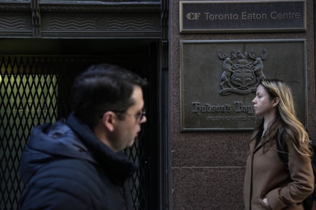 People walk past the Hudson's Bay store in Toronto on Monday March 10, 2025. 