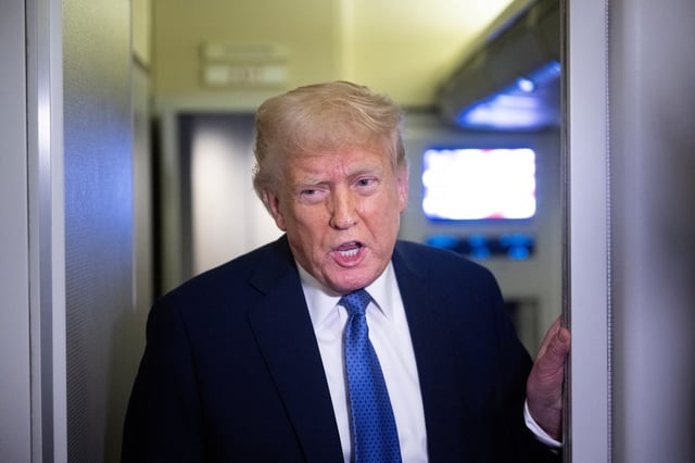 President Donald Trump speaks to reporters aboard Air Force One while flying to Washington, DC, from Florida, on March 16, 2025, above Virginia.