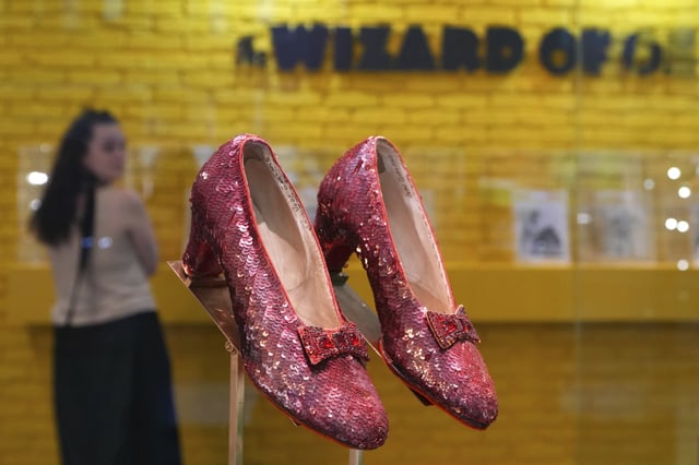 FILE - The original ruby slippers worn by Judy Garland in the classic 1939 film The Wizard of Oz are displayed in London ahead of being offered for auction on Dec. 7, at Heritage Auctions in the US, Wednesday, Nov. 27, 2024. (AP Photo/Kirsty Wigglesworth, file)