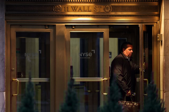 A man enters the New York Stock Exchange (NYSE) in New York City, U.S., March 17, 2025. REUTERS/Kylie Cooper