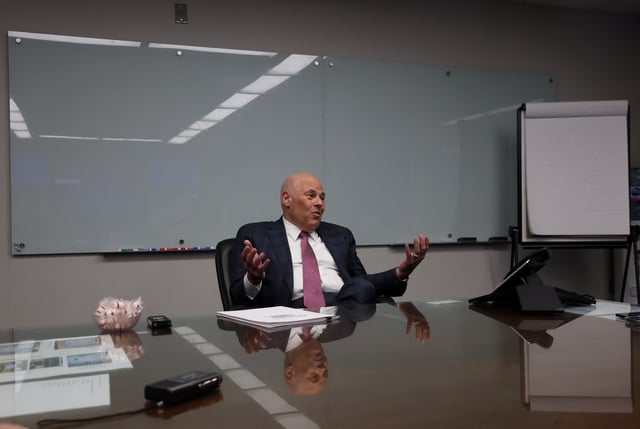 U.S. Postmaster General Louis DeJoy responds to a question during an interview with Reuters at the U.S. Postal Service Headquarters in Washington, U.S., April 20, 2022. Picture taken April 20, 2022. REUTERS/Leah Millis/File photo