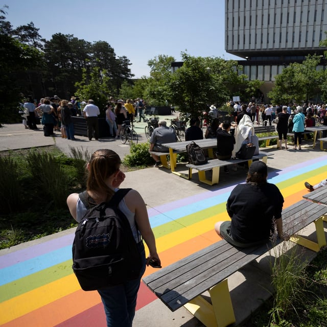 The University of Waterloo campus community gathers in the Arts Quad for a vigil in Waterloo, Ont., Thursday, June 29, 2023. THE CANADIAN PRESS/Nicole Osborne