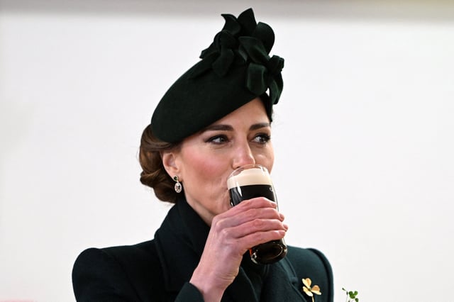 Britain&#39;s Catherine, Princess of Wales takes a sip of Guinness during her visit to Wellington Barracks, in central London, on March 17, 2025, where she met with meet with Irish Guards for their St Patrick&#39;s Day Parade.