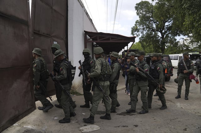 FILE - Soldiers raid the Tocorón Penitentiary Center, where the Tren de Aragua gang originated, in Tocorón, Venezuela, Sept. 20, 2023. (AP Photo/Ariana Cubillos, File)