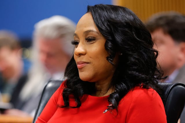 FILE - Fulton County District Attorney Fani Willis looks on during a hearing on the Georgia election interference case, Friday, March, 1, 2024, in Atlanta. (AP Photo/Alex Slitz, Pool, File)