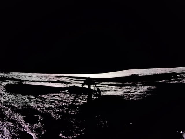 Firefly's Blue Ghost lunar lander captures photo of its shadow on the Moon with the volcanic feature, Mons Latreille, visible on the top right side of the lunar surface.
