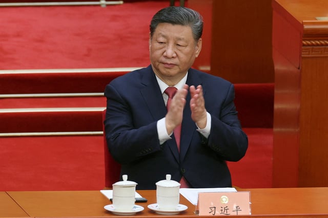 Chinese President Xi Jinping applauds at the closing session of the Chinese People's Political Consultative Conference (CPPCC) at the Great Hall of the People in Beijing, China March 10, 2025. REUTERS/Florence Lo/File Photo