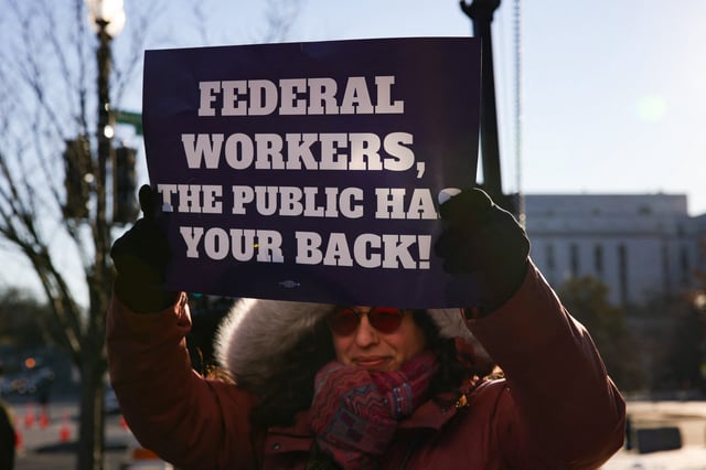 Demonstrators gather outside of the offices of the Department of Health and Human Services in Washington, D.C. on February 14, 2025 to protest against Elon Musk&#39;s Department of Government Efficiency (DOGE) budget cuts and employee terminations.