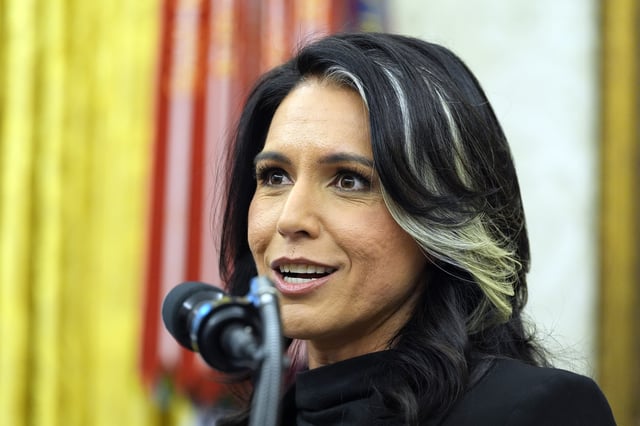 FILE - Director of National Intelligence Tulsi Gabbard listens to President Donald Trump during her swearing-in at the Oval Office of the White House, Feb. 12, 2025, in Washington. (Photo/Alex Brandon, File)