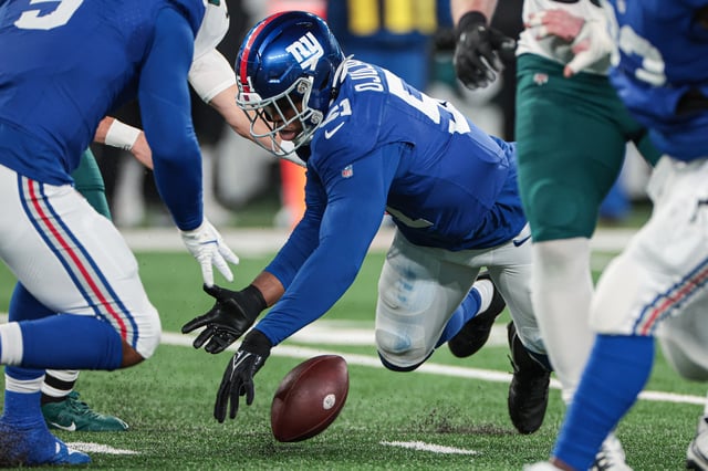 Jan 7, 2024; East Rutherford, New Jersey, USA; New York Giants linebacker Azeez Ojulari (51) recovers a fumble by Philadelphia Eagles quarterback Marcus Mariota (not pictured) during the second half at MetLife Stadium. Mandatory Credit: Vincent Carchietta-USA TODAY Sports/File Photo
