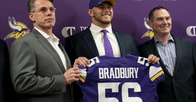 Minnesota Vikings first-round draft pick Garrett Bradbury holds his jersey with, from left, general manager Rick Spielman and head coach Mike Zimmer during a news conference at the TCO Performance Center News in Eagan, Minn., on Friday, April 26, 2019. (Renee Jones Schneider/Minneapolis Star Tribune/TNS)