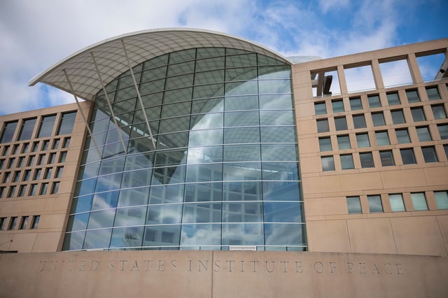 A sign for the United States Institute of Peace is seen on its building headquarters on February 20, 2025 in Washington.