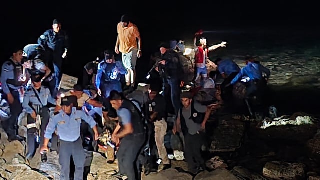 Rescue teams working on the site of a plane crash in Roatan, Honduras on March 17, 2025.