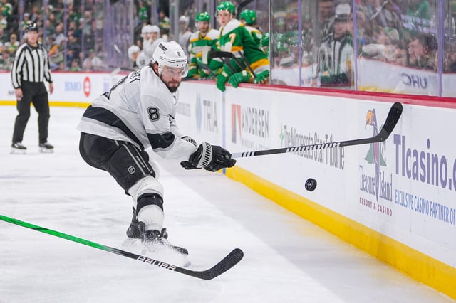 Mar 17, 2025; Saint Paul, Minnesota, USA;  Los Angeles Kings defenseman Drew Doughty (8) bats the puck out of the air against the Minnesota Wild in the third period at Xcel Energy Center. Mandatory Credit: Brad Rempel-Imagn Images