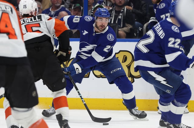 Mar 17, 2025; Tampa, Florida, USA;  Tampa Bay Lightning left wing Nick Paul (20) skates with the puck against the Philadelphia Flyers during the third period at Amalie Arena. Mandatory Credit: Kim Klement Neitzel-Imagn Images