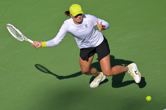 Mar 14, 2025; Indian Wells, CA, USA;  Iga Swiatek (POL) hits a shot against Mirra Andreeva (not pictured) during the semifinal match at the BNP Paribas Open at the Indian Well Tennis Garden. Mandatory Credit: Jayne Kamin-Oncea-Imagn Images/File Photo