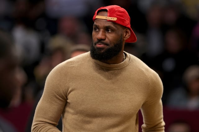Mar 10, 2025; Brooklyn, New York, USA; Los Angeles Lakers injured forward LeBron James (23) on the court during a time out during the first quarter against the Brooklyn Nets at Barclays Center. Mandatory Credit: Brad Penner-Imagn Images/File Photo