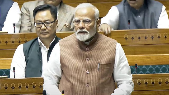 Prime Minister Narendra Modi speaks in the Lok Sabha on Tuesday. (Sansad TV)