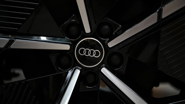 The company logo of Germany's car producer Audi is seen on a wheel of a new car pictured in headquarters in Ingolstadt, southern Germany, on August 24, 2023.