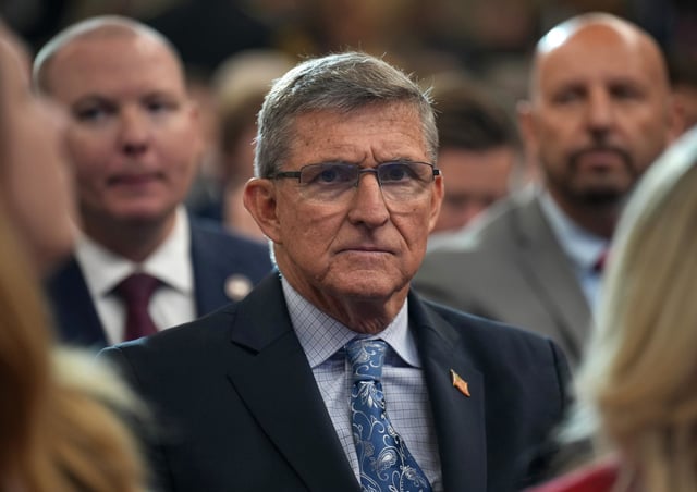 Former National Security Advisor Michael Flynn looks on before President Donald Trump delivers remarks at the Justice Department March 14, 2025.