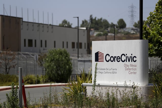 A sign for the Otay Mesa Detention Center sits in front of the building in San Diego. A federal appeals court has tossed out California’s ban on privately owned immigration detention facilities, keeping intact a key piece of the world’s largest detention system for immigrants.