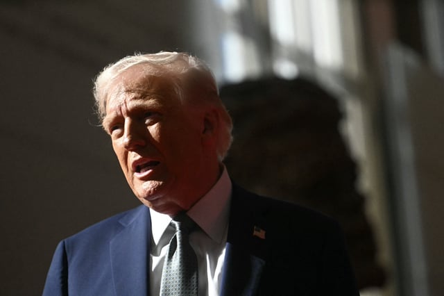 President Donald Trump talks to members of the media as he visits the John F. Kennedy Center for the Performing Arts in Washington, DC, on March 17, 2025.