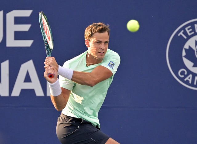 Aug 7, 2024; Montreal, Quebec, Canada; Vasek Pospisil (CAN) hits a backhand against Sebastian Korda (USA) (not pictured) in first round play at IGA Stadium. Mandatory Credit: Eric Bolte-USA TODAY Sports/File Photo