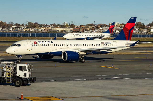 Delta Air Lines Airbus A220-300 passenger aircraft spotted taxiing on the runway and taxiway of LaGuardia airport in NYC with a Boeing 737 of Delta in arriving in the background. The narrow body Airbus A220 formerly Bombardier CS300 BD-500-1A11 of Delta Airlines has the registration tail number N301DU and is powered by 2x PW jet engines. Delta Air Lines is a major airline carrier in the United States of America with headquarters and hub in Atlanta, Georgia, member of SkyTeam aviation alliance group. Delta is the second largest airline in the world with a fleet of 993 planes and ranked as the best in the US. LaGuardia Airport LGA, Queens, New York City, USA on November 12, 2024 (Photo by Nicolas Economou/NurPhoto via Getty Images)