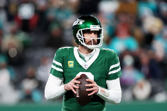 Aaron Rodgers #8 of the New York Jets looks to pass against the Miami Dolphins during the fourth quarter at MetLife Stadium.