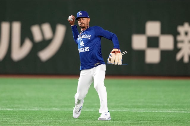 Mar 15, 2025; Bunkyo, Tokyo, Japan; Los Angeles Dodgers shortstop Mookie Betts (50) warms up before the game against the Yomiuri Giants at Tokyo Dome. Mandatory Credit: Darren Yamashita-Imagn Images/File Photo